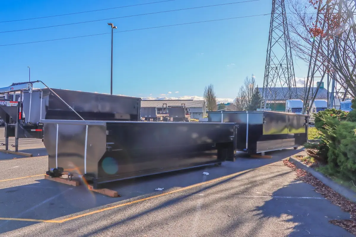 Roll-off dumpster ready for waste disposal at job site for 2 Yard Dumpster Rental in Signal Hill